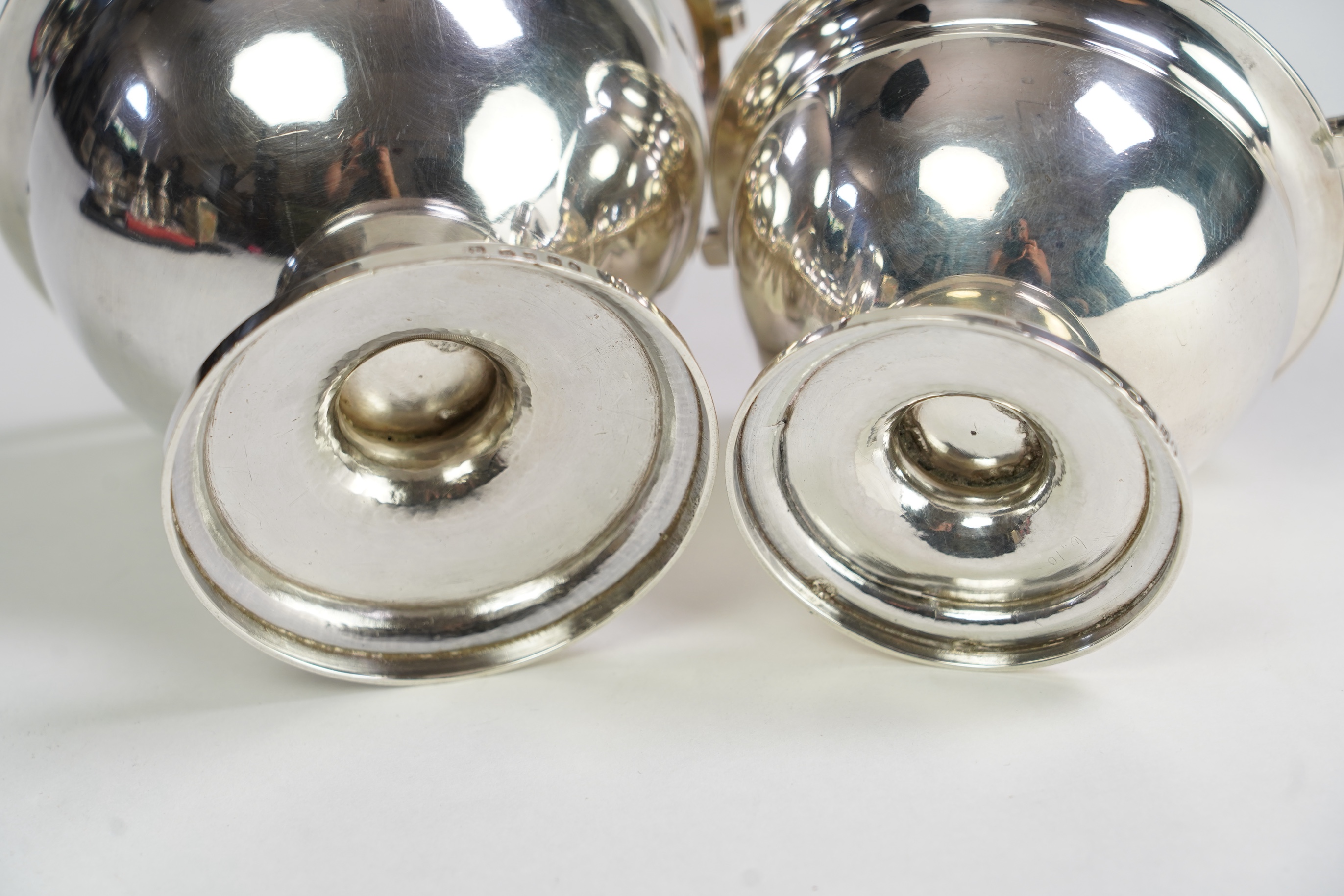 Two George III graduated silver pedestal sugar baskets, by James Darquits